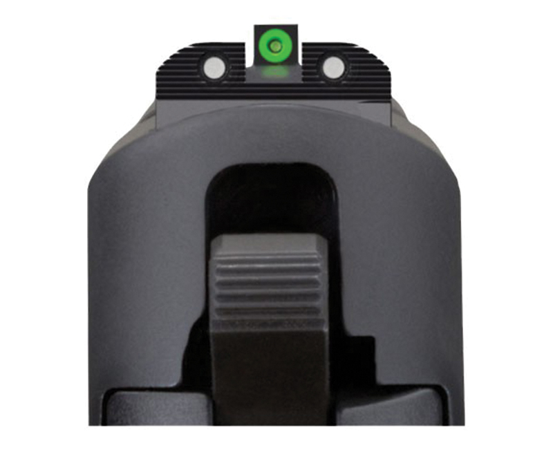 Close-up of handgun rear sight with green dot