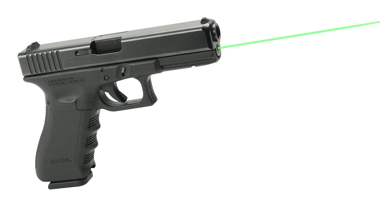 Black handgun with green laser sight beam