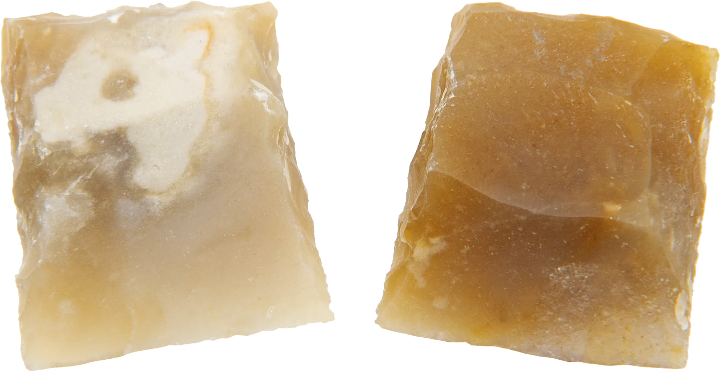 Two translucent brown flint stone fragments