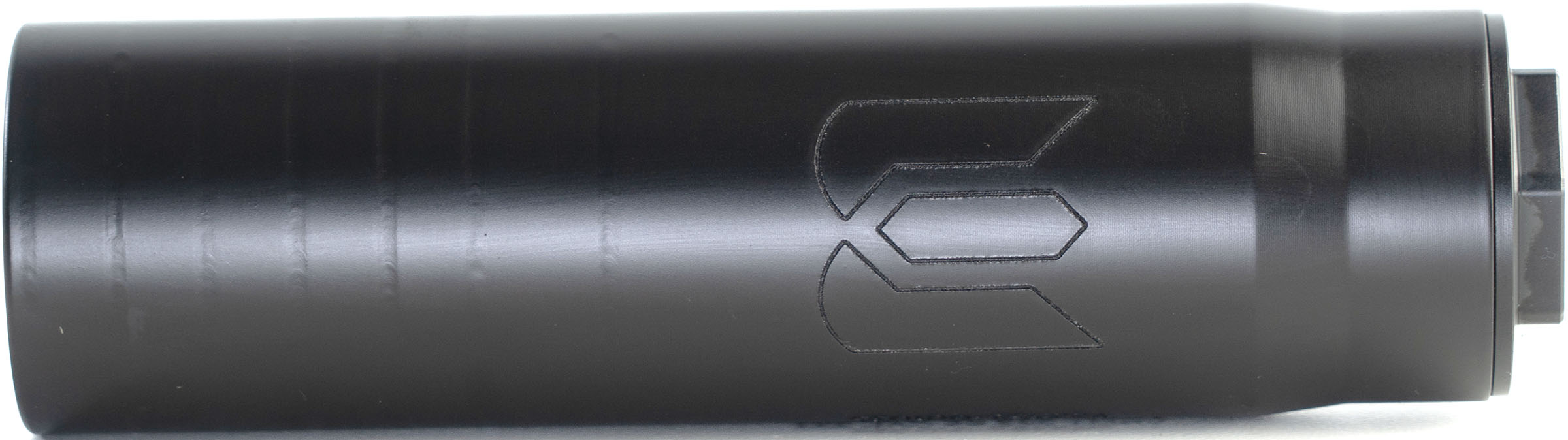 Black cylindrical firearm suppressor with engraved logo