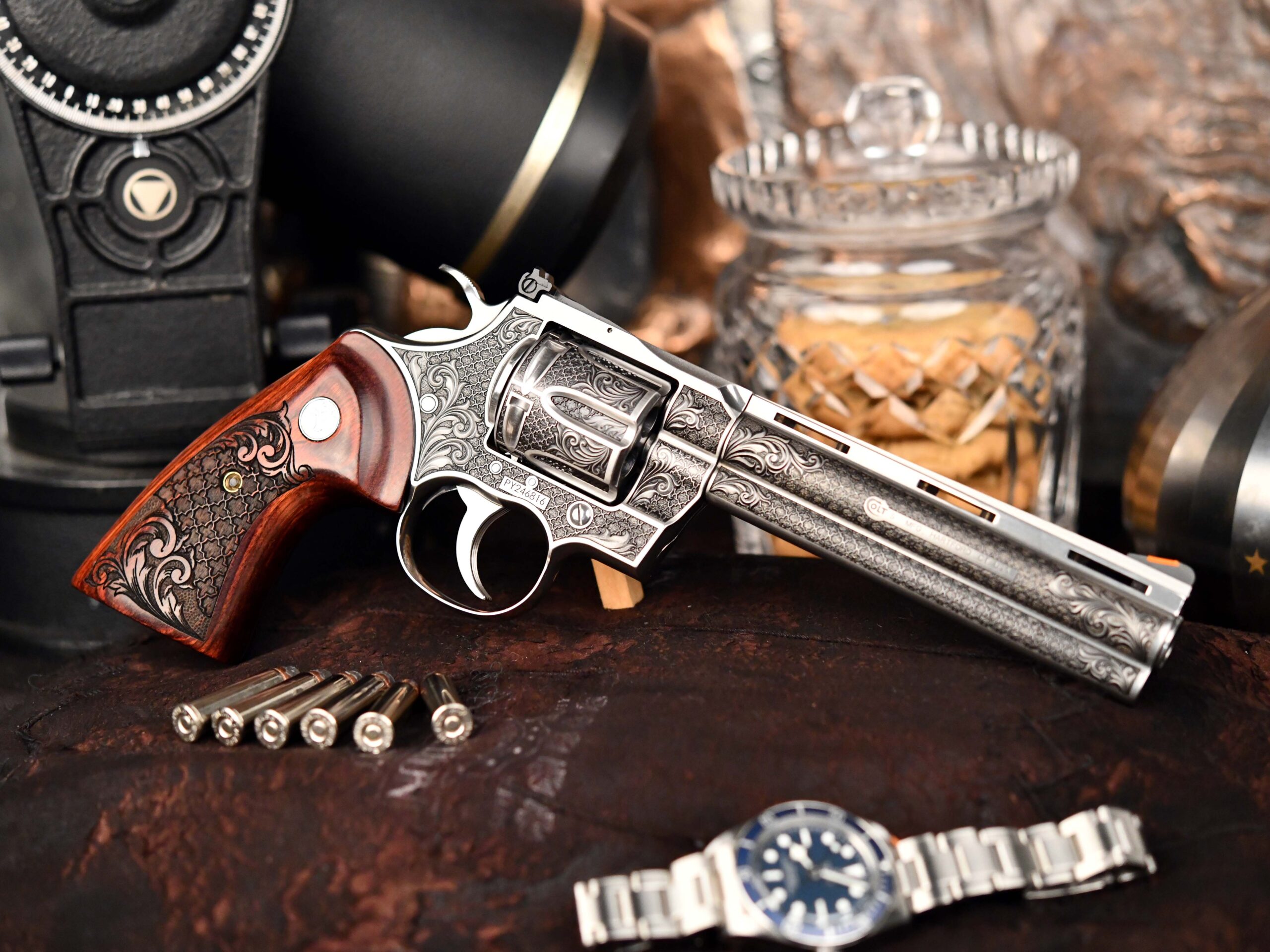 Engraved revolver with wooden grip and bullets
