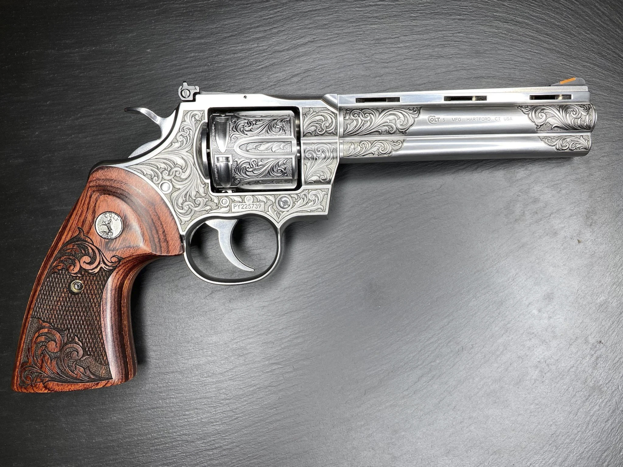Engraved Colt revolver with wooden grip