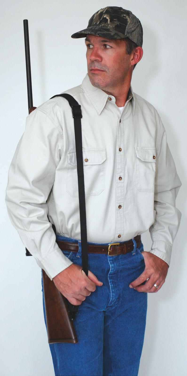 Man with shotgun wearing camouflage cap