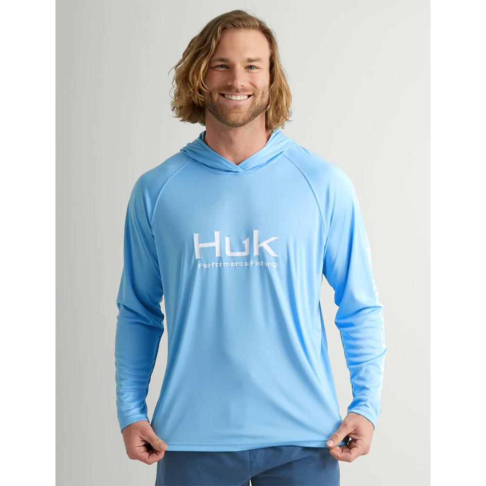 Man wearing light blue Huk performance fishing hoodie
