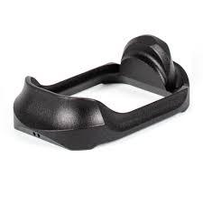 Black handgun magazine base plate with grip extension