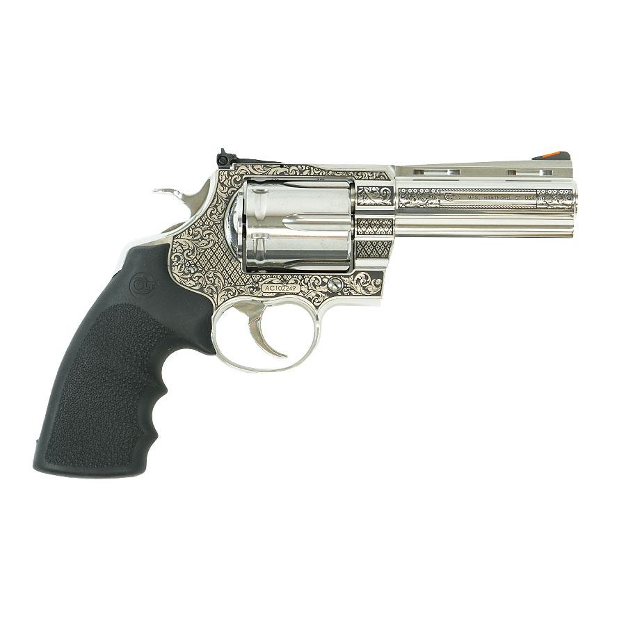 Ornate engraved silver revolver with black grip