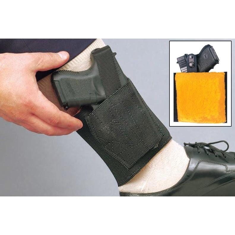 Handgun in ankle holster being drawn
