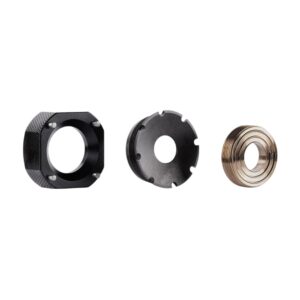 Three metal threaded ring components on white background