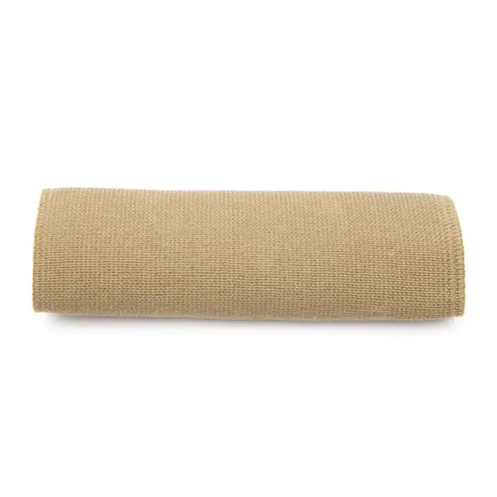 Rolled beige fabric on white background