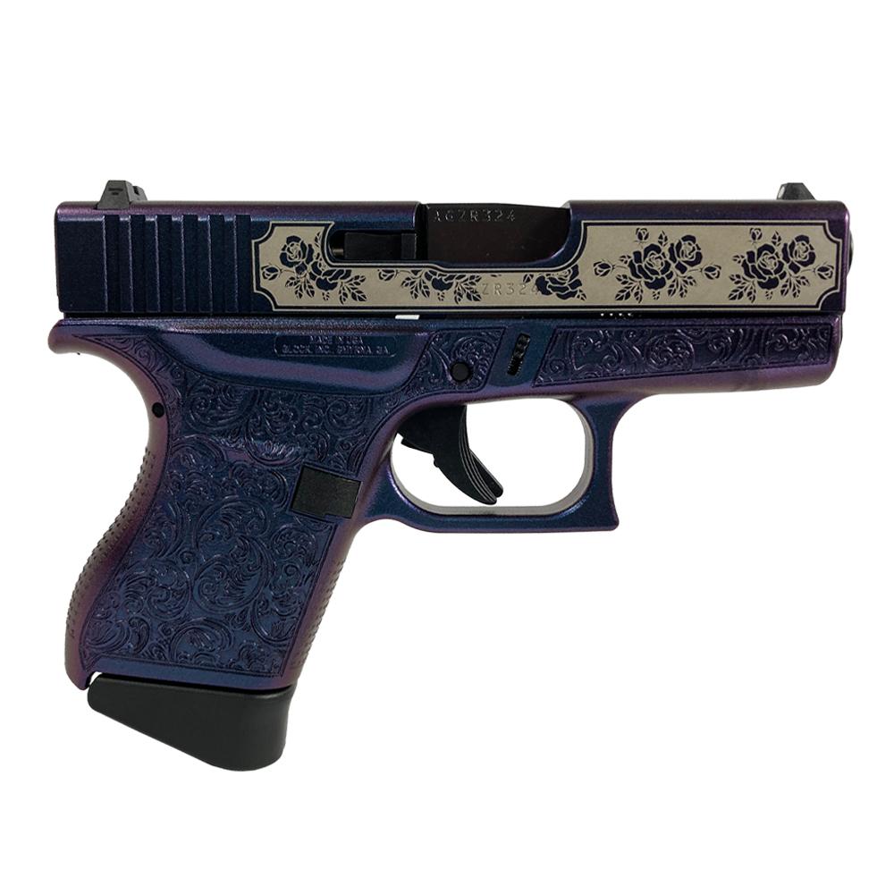 Purple engraved handgun with floral detailing