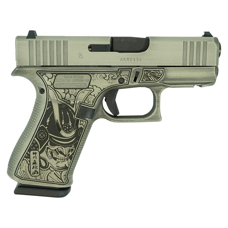 Engraved handgun with samurai-themed grip design