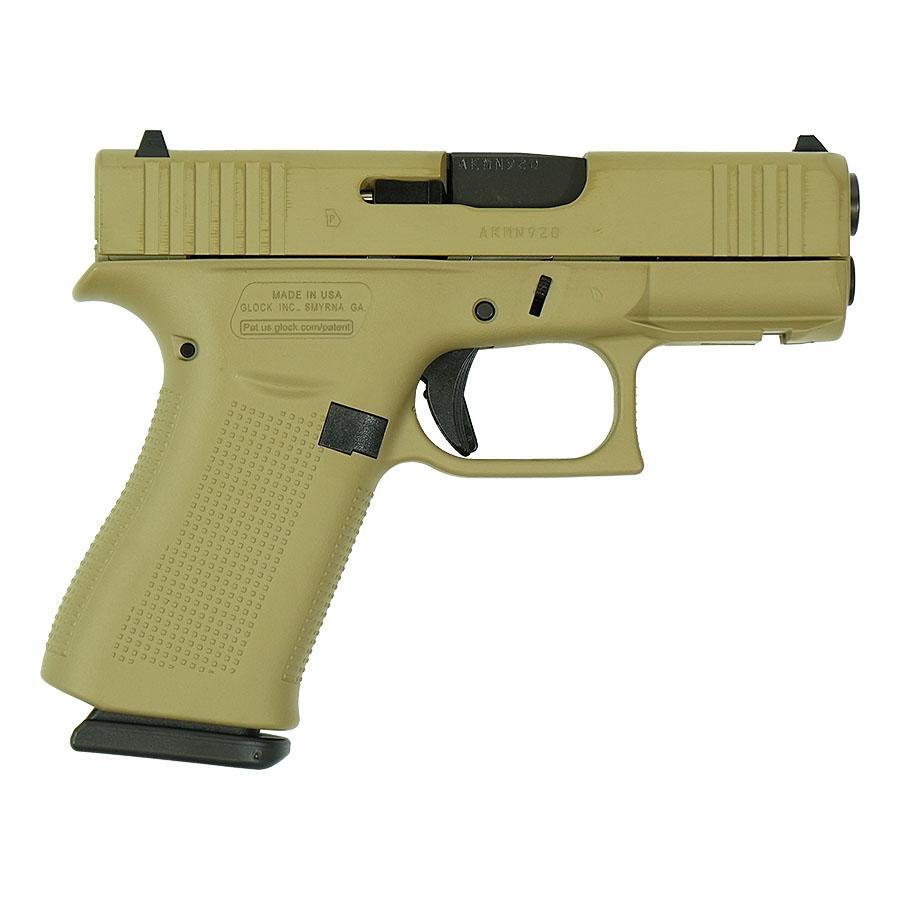 Tan Glock semi-automatic pistol on white background