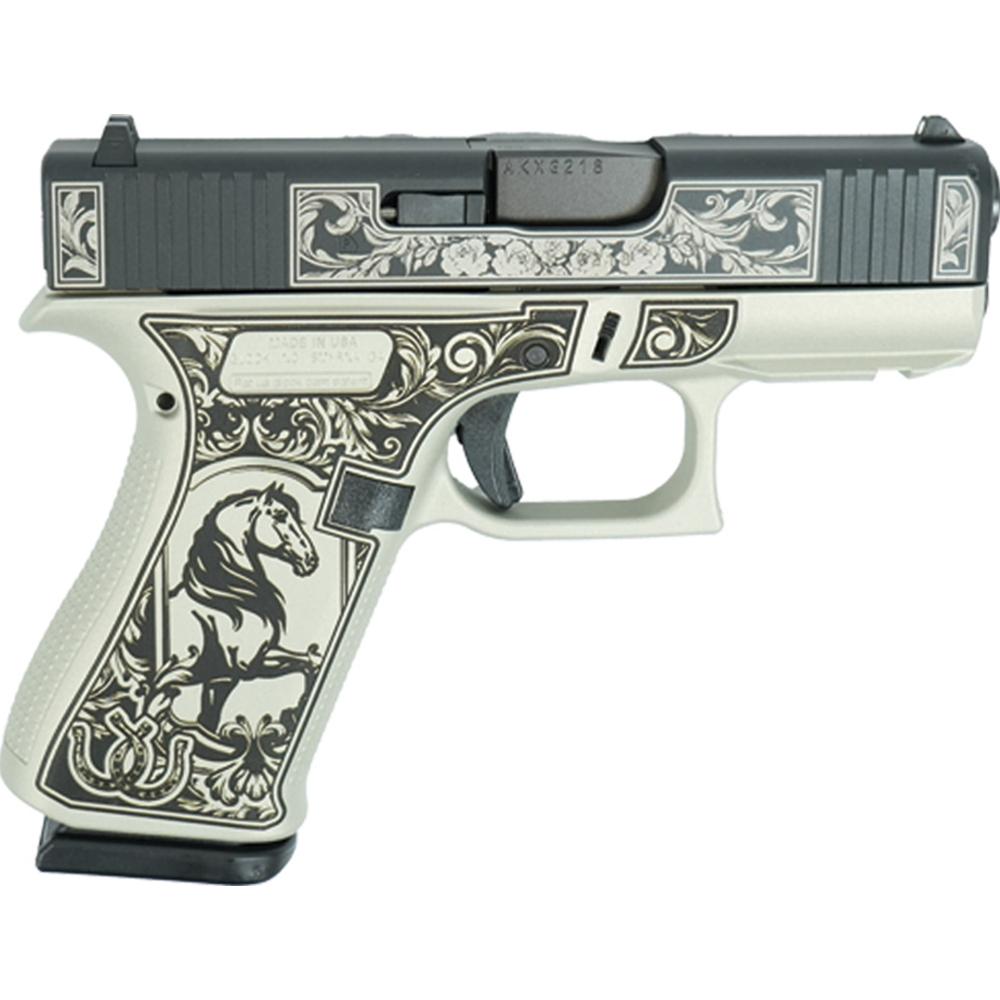 Ornately engraved handgun with horse illustration grip