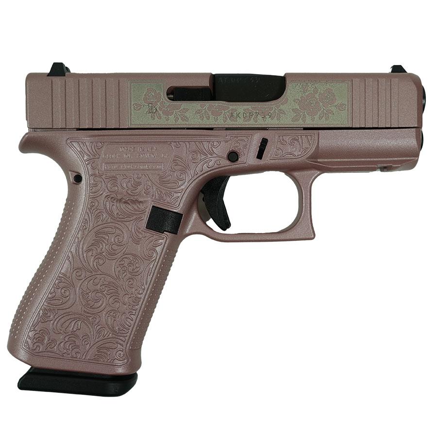 Floral engraved pink semi-automatic handgun