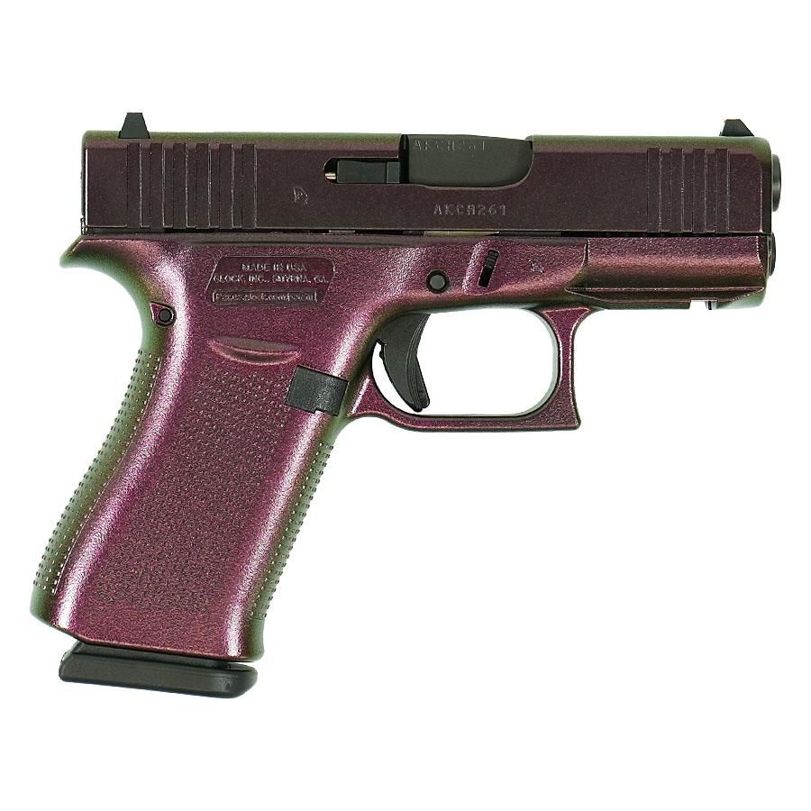 Metallic purple Glock semi-automatic pistol on white background