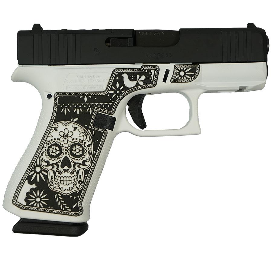 Decorative handgun with sugar skull grip design
