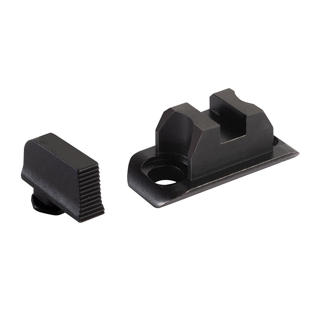 Black metal firearm sight components on white background