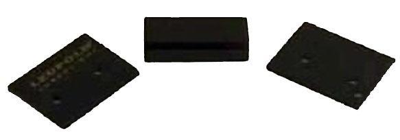 Three black rubber ramp blocks on white background