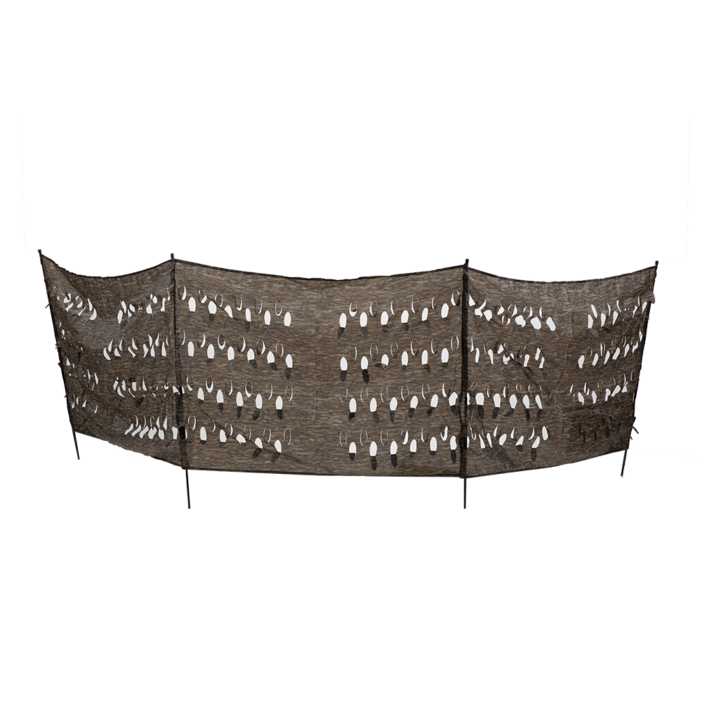 Curved camouflage mesh screen with white leaf cutouts