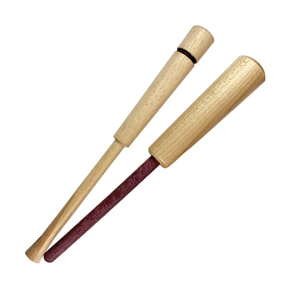 Two wooden muddler sticks on white background