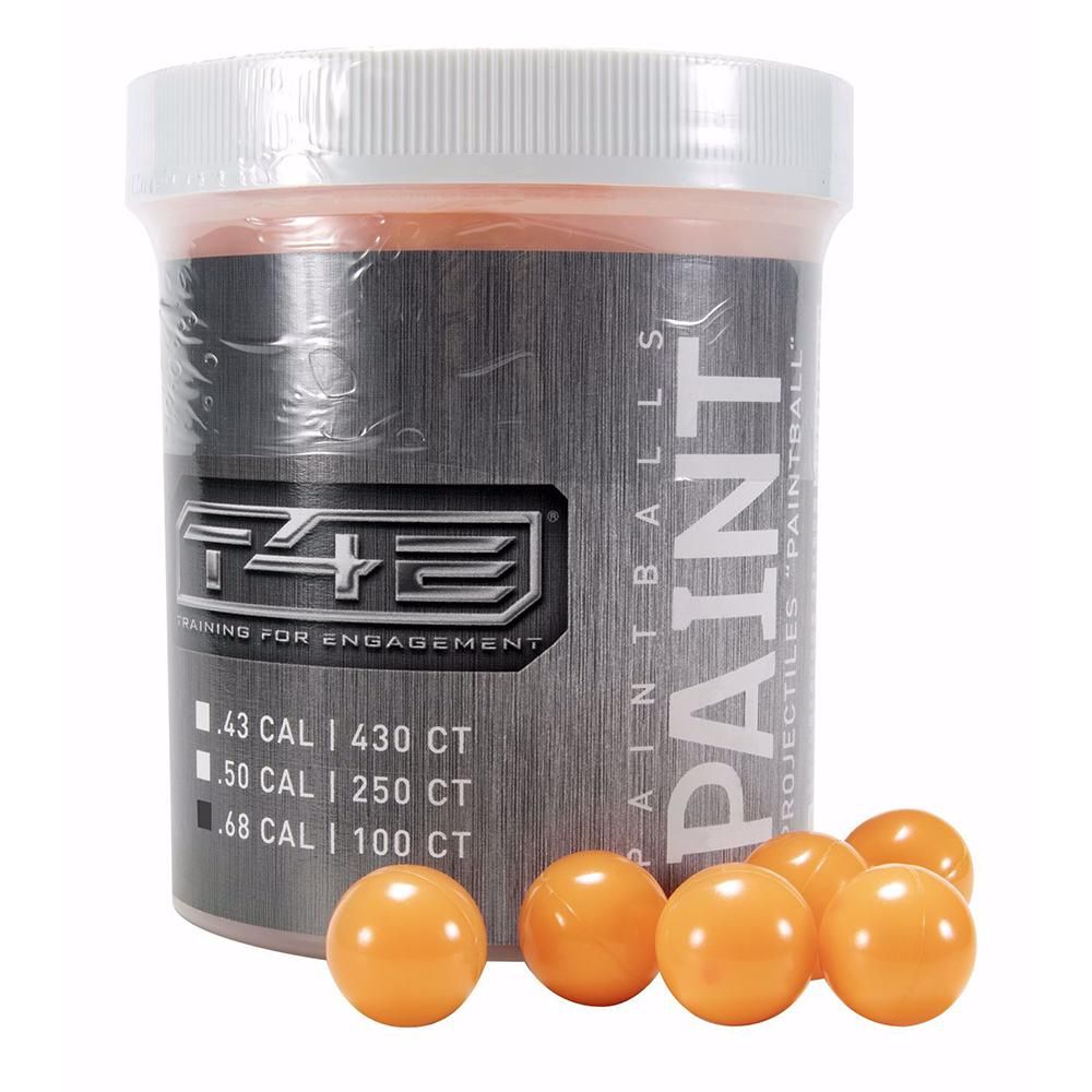 Container of orange paintballs with several in front