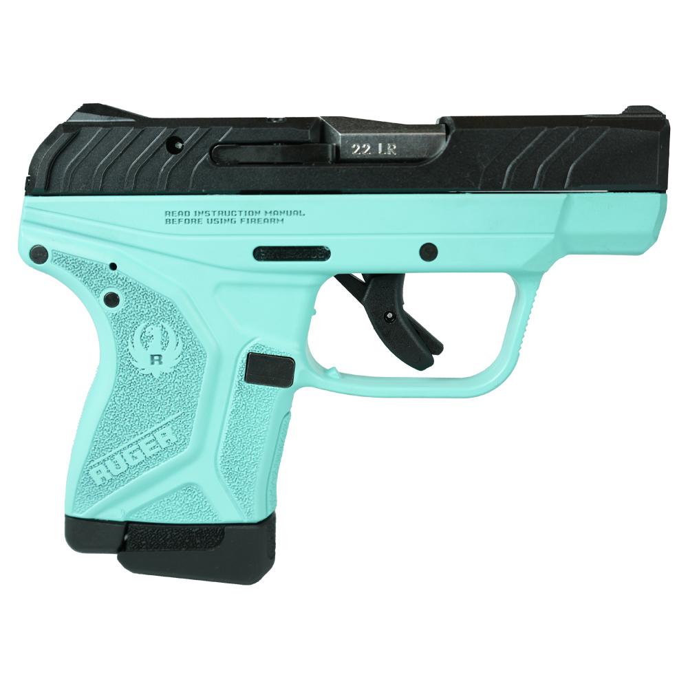 Turquoise and black compact handgun on white background