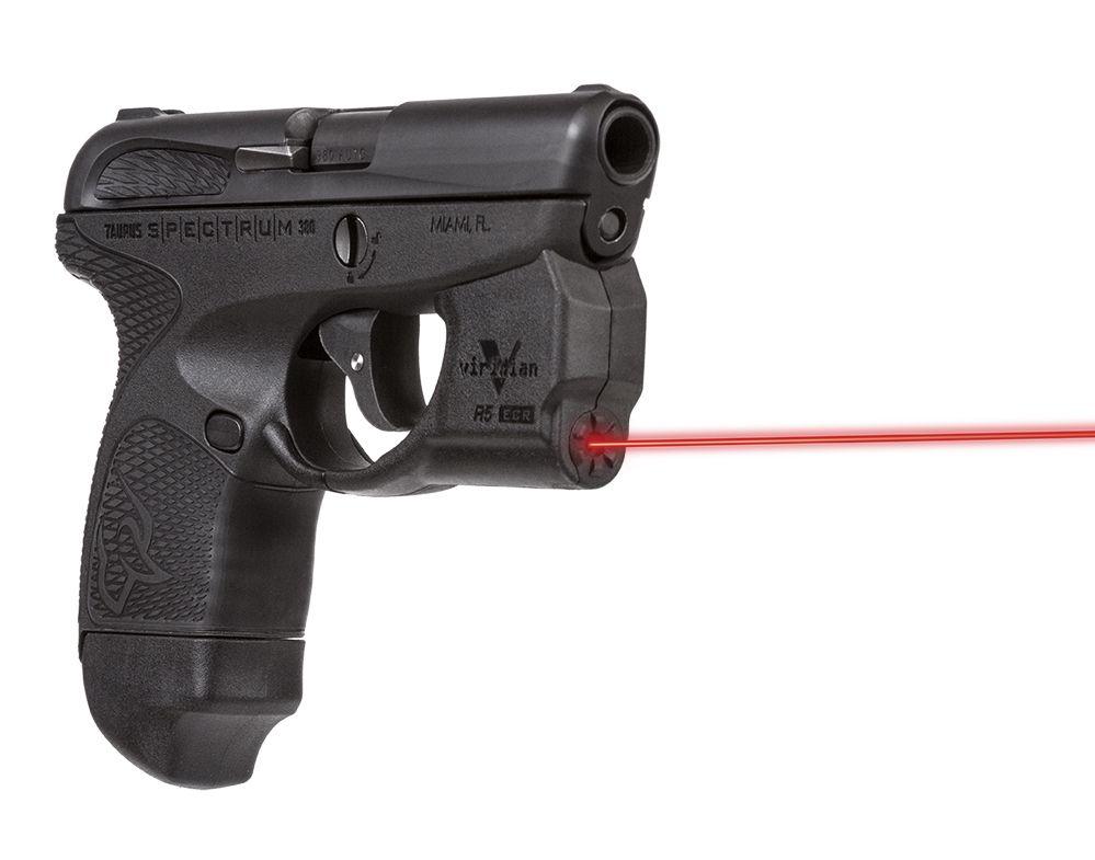 Compact handgun with red laser sight attached