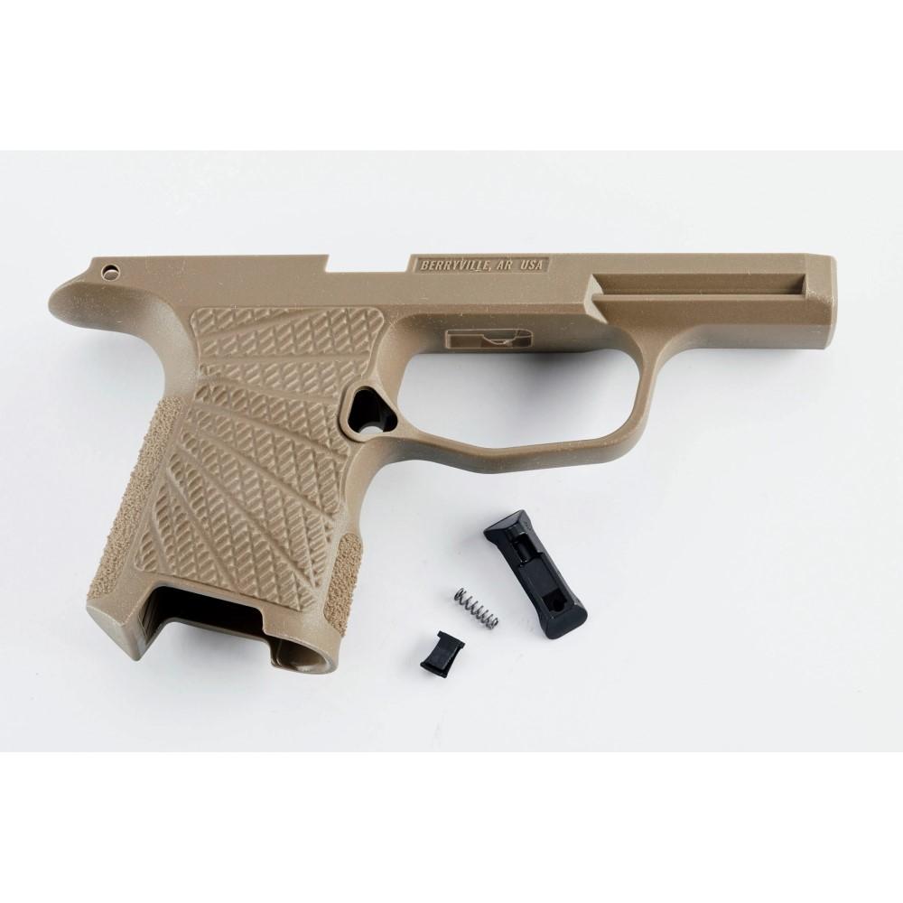 Tan polymer handgun frame with small parts