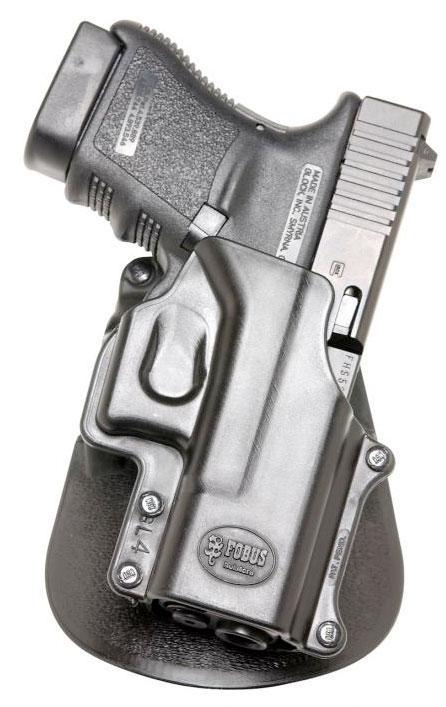 Handgun in black holster on paddle mount