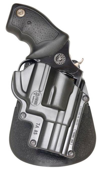Revolver in black holster on white background