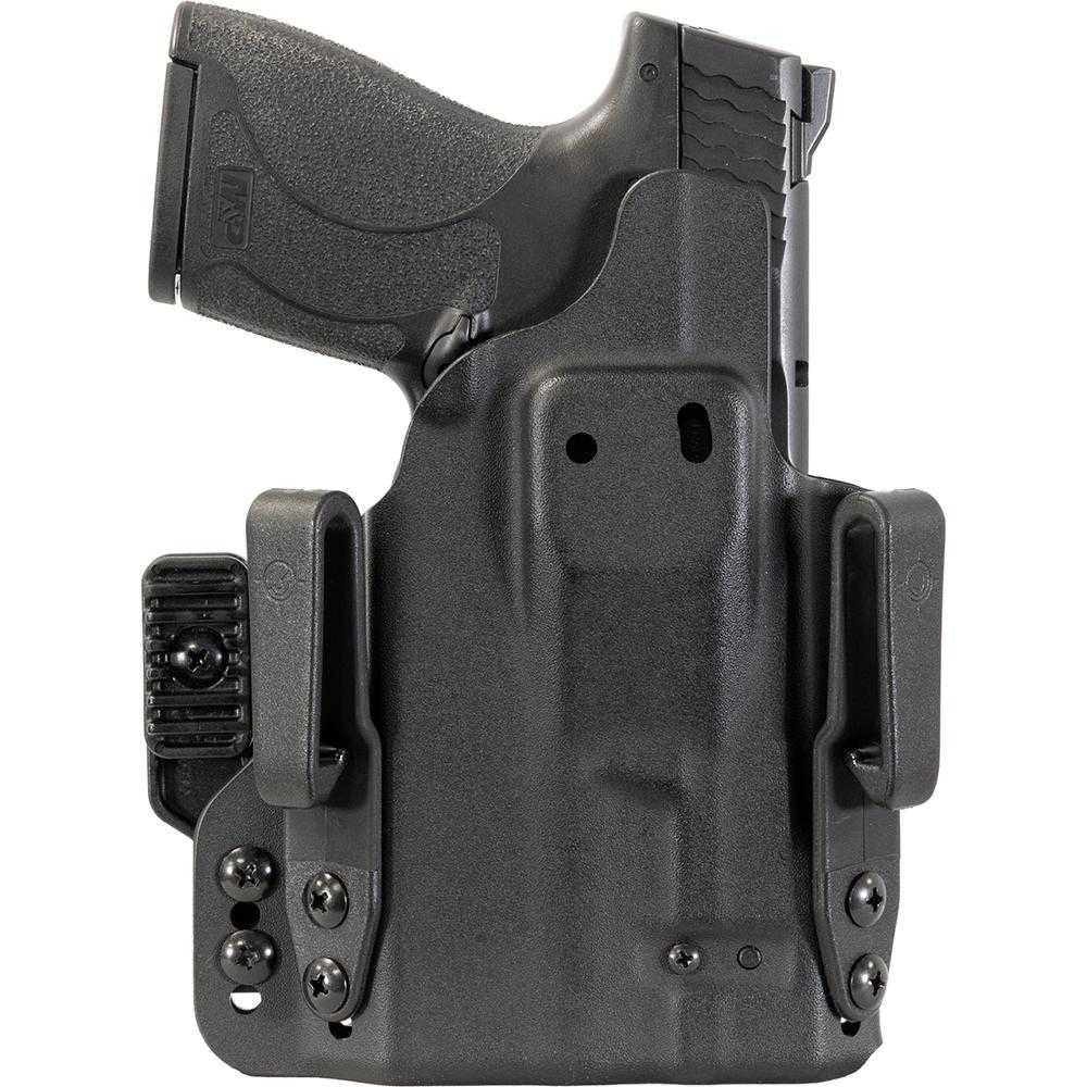 Black handgun in molded belt holster