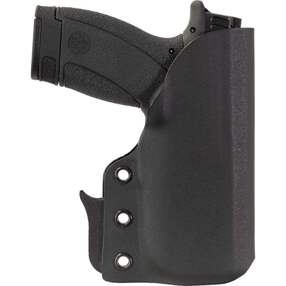Handgun in black molded holster