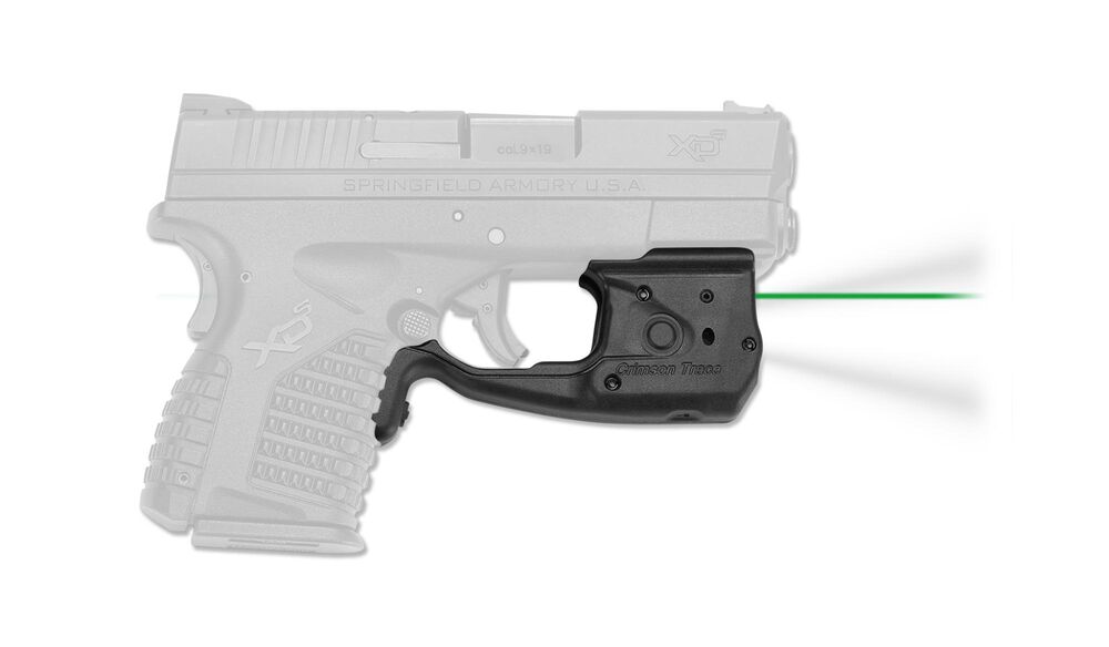 Handgun with mounted green laser sight attachment