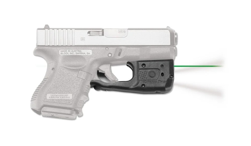 Handgun with mounted green laser sight