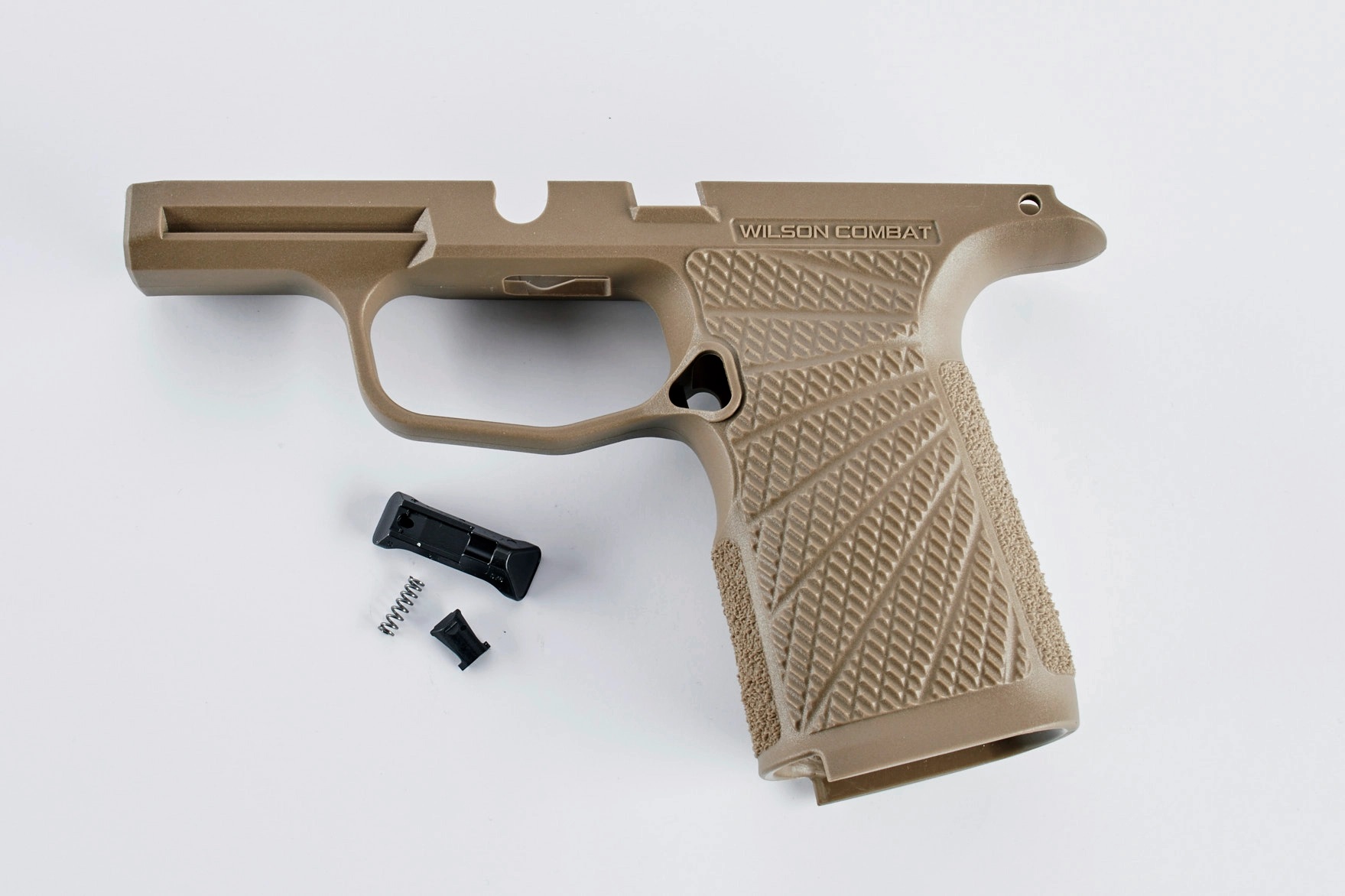 Tan Wilson Combat pistol frame with parts