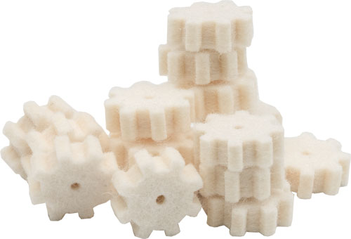 Small white plastic gears stacked together