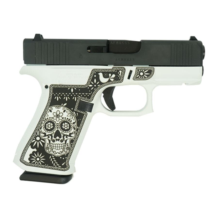 Decorative handgun with sugar skull design