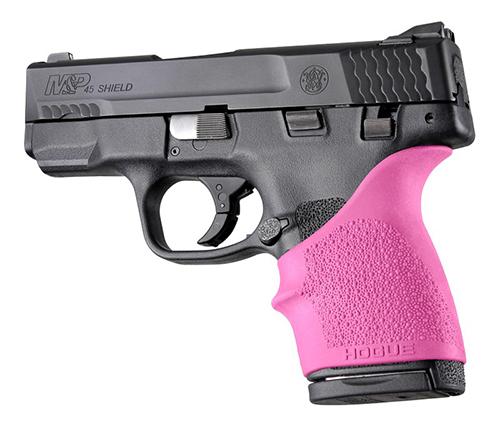 Black handgun with pink grip on white background