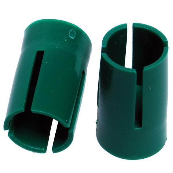 Two green slotted plastic cylindrical inserts