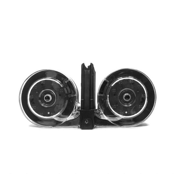 Clear double drum firearm magazine on white background