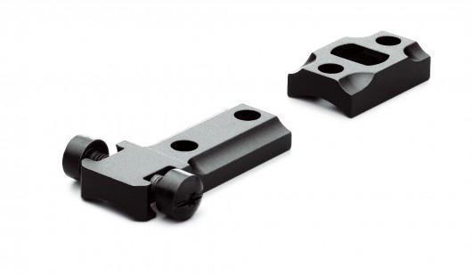 Black metal scope mount components on white background
