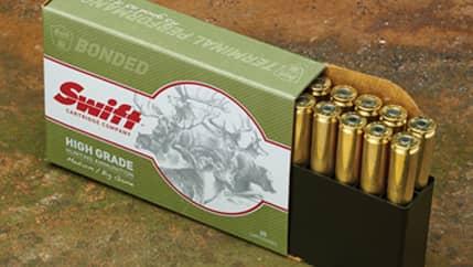 Box of Swift rifle ammunition with brass cartridges