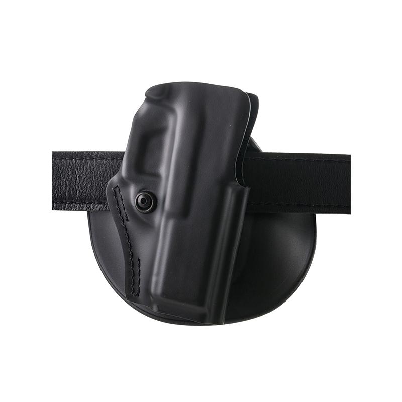 Black concealed carry holster on leather belt