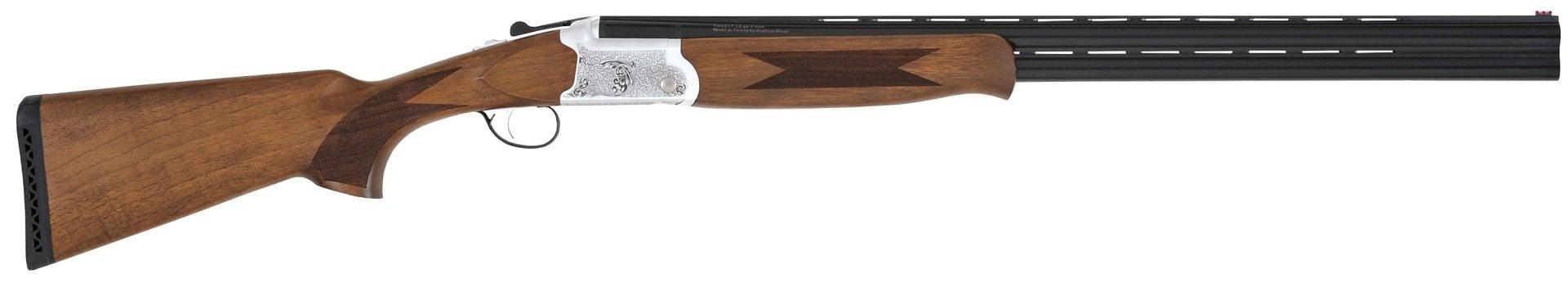 Side view of wooden-stock shotgun on white background