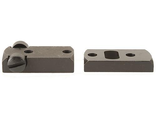 Two machined metal mounting blocks with holes