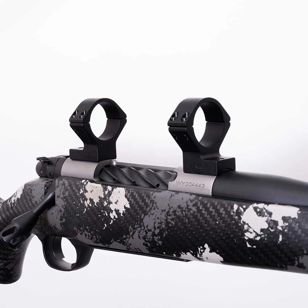 Bolt-action rifle with carbon fiber stock and scope mounts