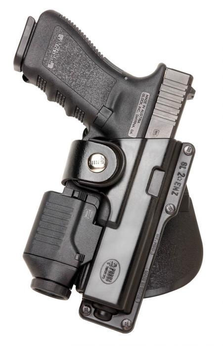 Handgun in holster with mounted tactical light
