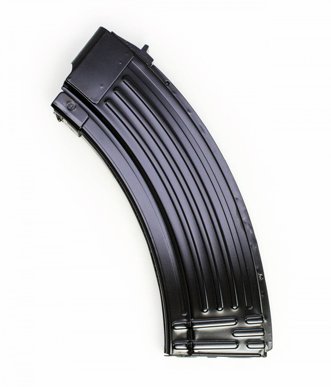 Curved black metal rifle magazine on white background