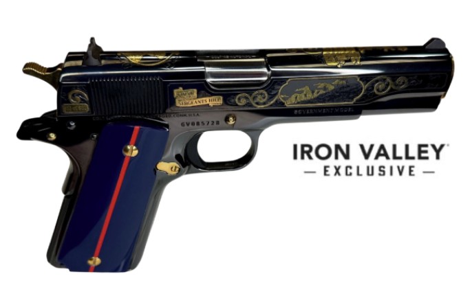 Ornate engraved handgun with blue grip panel