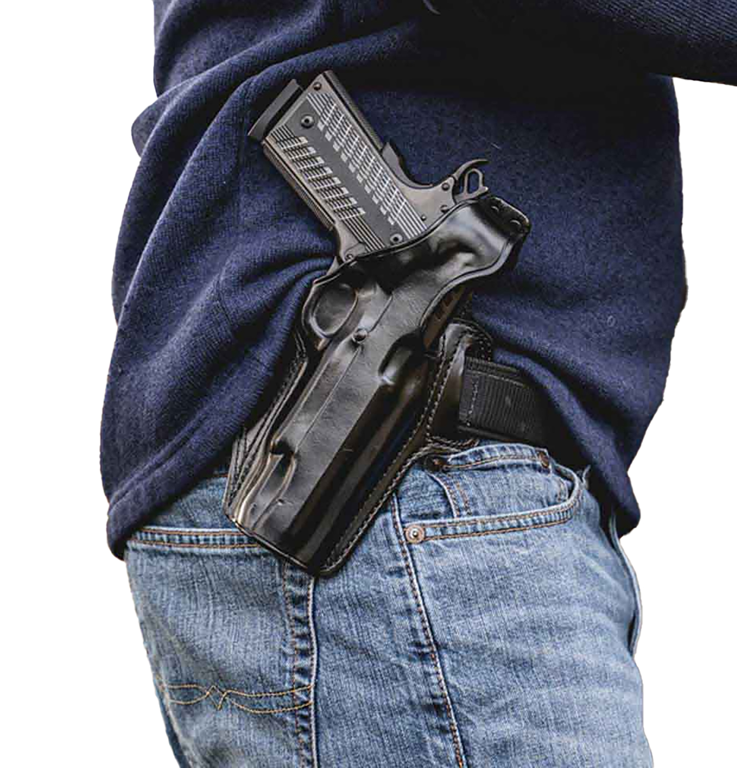 Handgun in waistband holster under sweatshirt